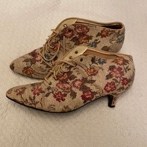 Floral quilted low heel booties.
